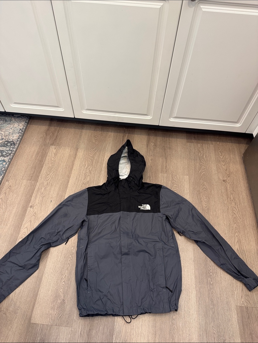 The North Face Men’s Gray and Black Hooded Raincoat